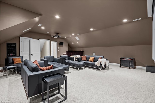 carpeted home theater with recessed lighting, visible vents, baseboards, and lofted ceiling