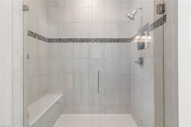 bathroom featuring a shower stall