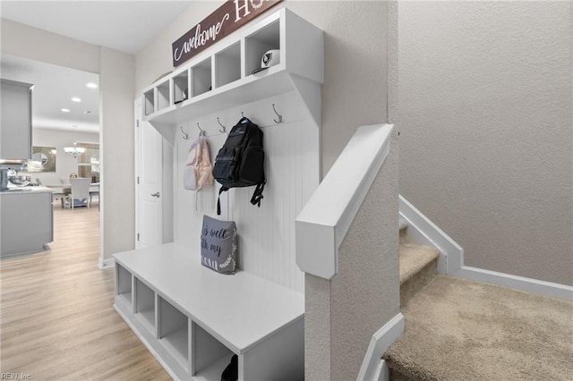 mudroom featuring light wood-type flooring, baseboards, and recessed lighting