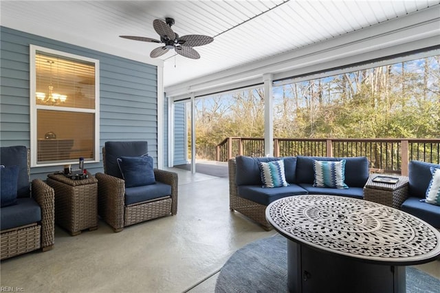 sunroom / solarium with ceiling fan