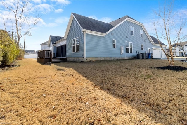 view of property exterior featuring cooling unit and roof with shingles