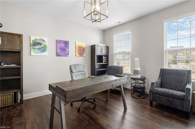 office space featuring visible vents, baseboards, a chandelier, and wood finished floors