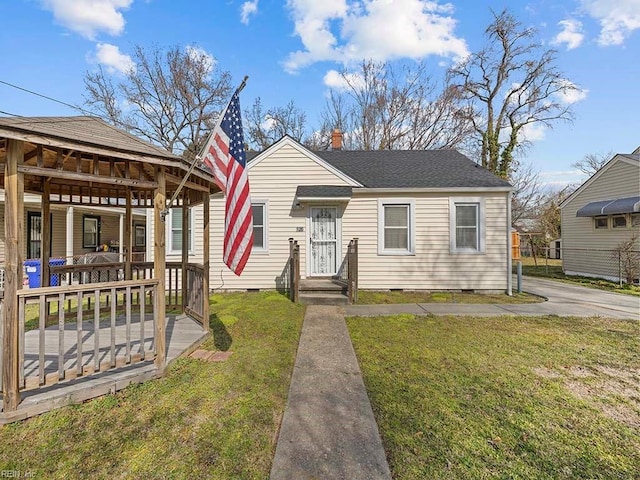 bungalow with roof with shingles, a chimney, a gazebo, crawl space, and a front lawn