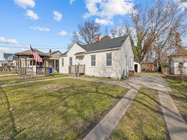 bungalow featuring roof with shingles, crawl space, a residential view, a front lawn, and a chimney