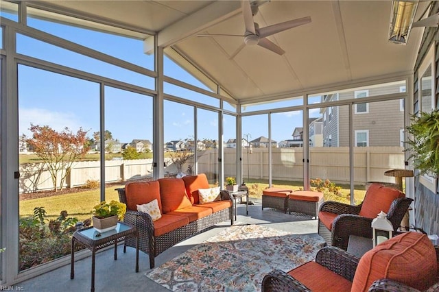 sunroom / solarium with a ceiling fan, plenty of natural light, and lofted ceiling with beams