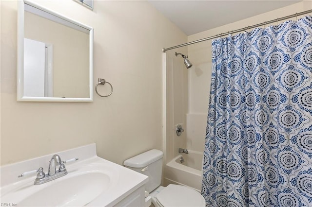 bathroom featuring toilet, shower / bath combination with curtain, and vanity