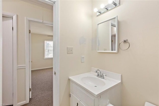 bathroom featuring vanity and baseboards