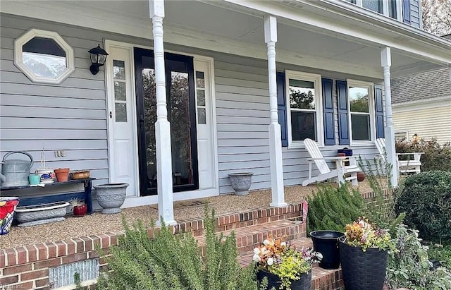 doorway to property featuring covered porch