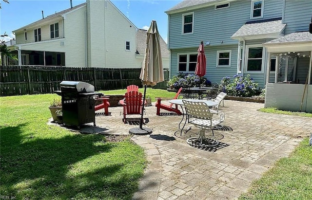 view of patio with fence and area for grilling