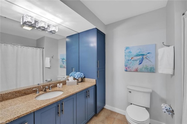 full bathroom with toilet, vanity, baseboards, and tile patterned floors