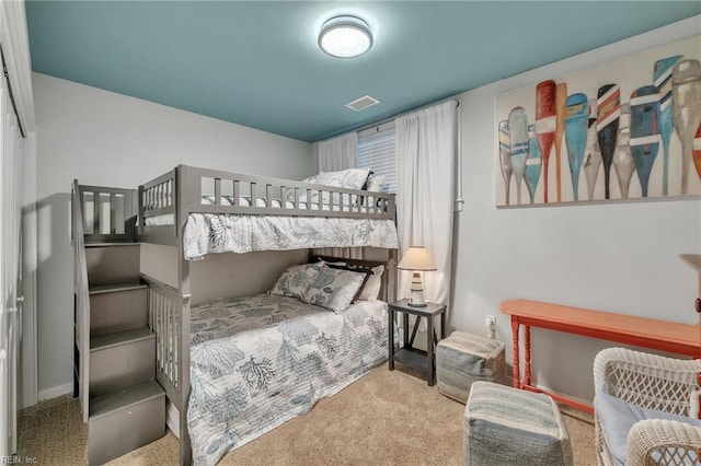 bedroom featuring visible vents and carpet flooring