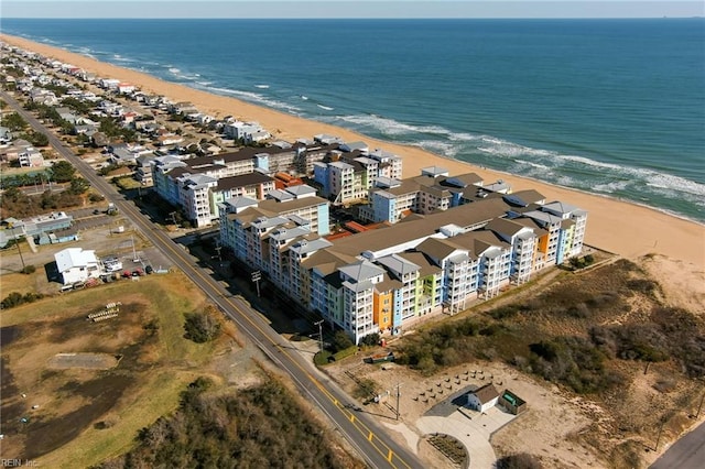 bird's eye view with a water view and a view of the beach