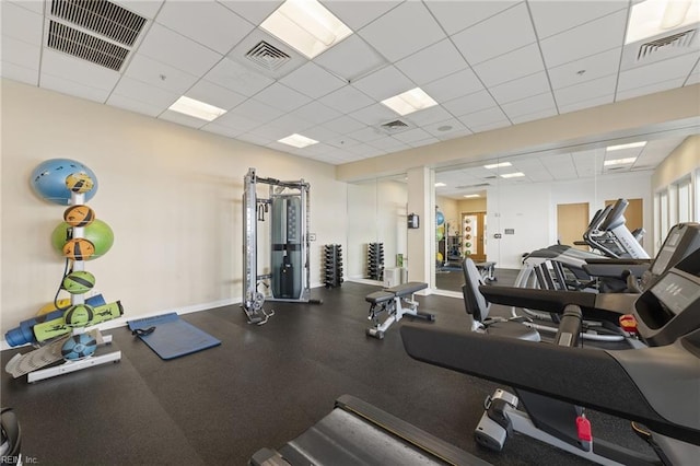 gym featuring a drop ceiling and visible vents