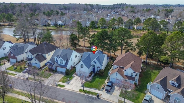 bird's eye view with a residential view and a water view