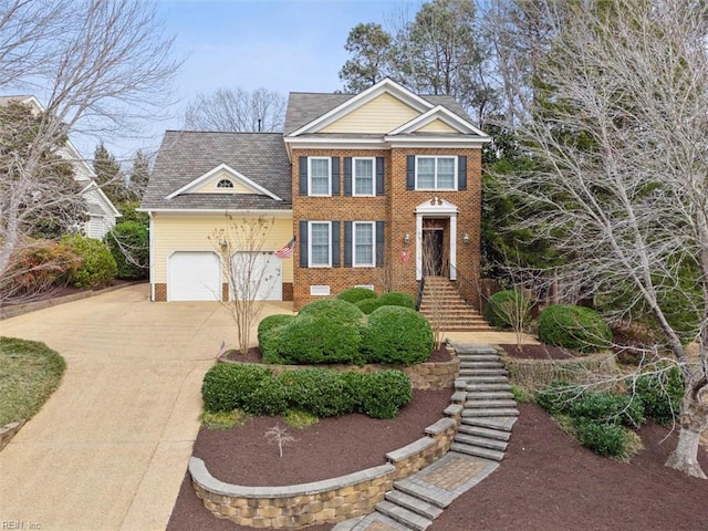 view of front of home featuring a garage, brick siding, driveway, and roof with shingles