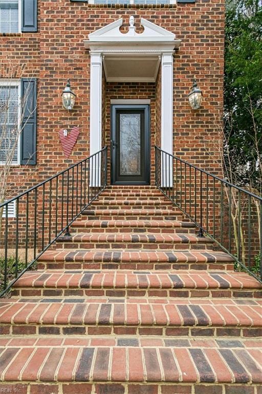 entrance to property with brick siding