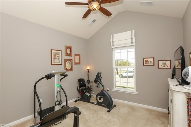 exercise area with visible vents, baseboards, lofted ceiling, and carpet