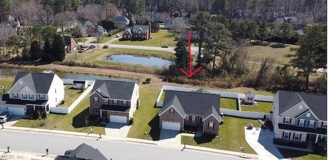 bird's eye view featuring a residential view and a water view