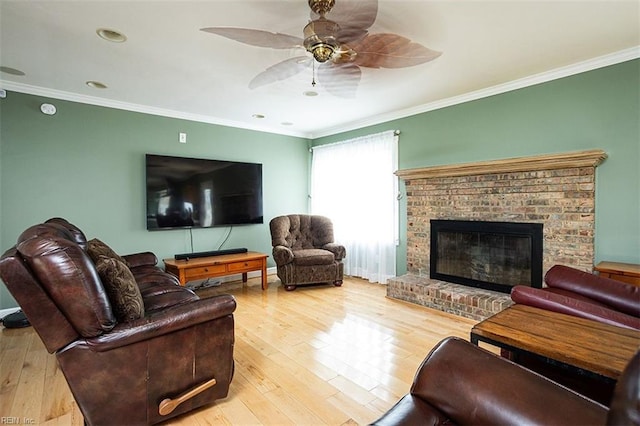 living area featuring ornamental molding and wood finished floors