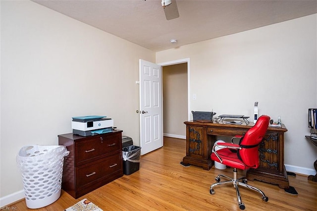 office space featuring light wood-style flooring and baseboards