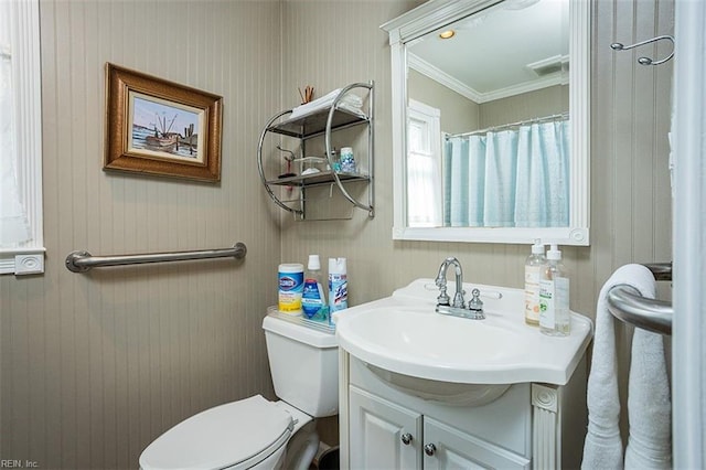 full bath with toilet, ornamental molding, vanity, and visible vents