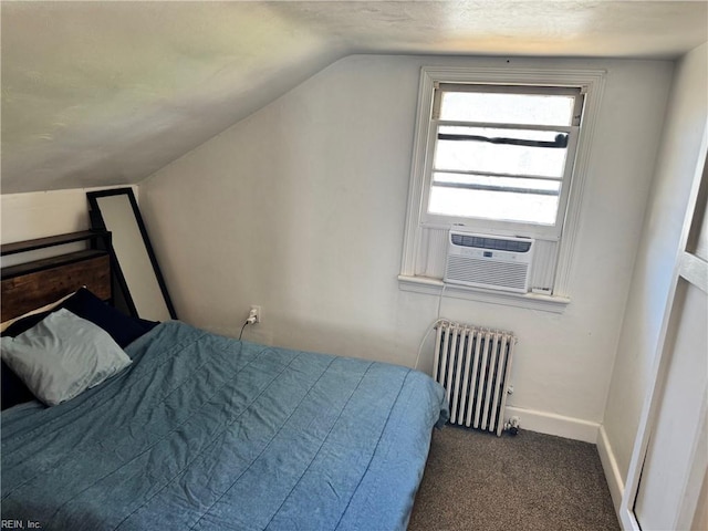 bedroom with carpet floors, lofted ceiling, radiator, cooling unit, and baseboards