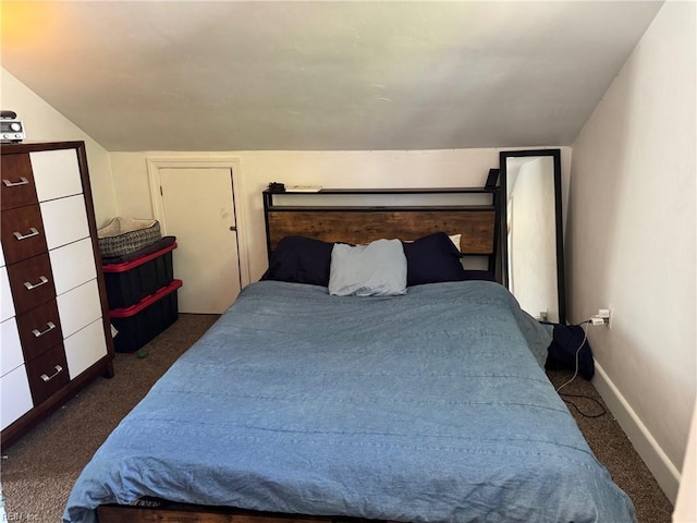 bedroom featuring baseboards, vaulted ceiling, and carpet flooring