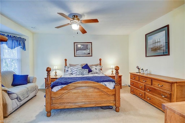 bedroom with light colored carpet and ceiling fan