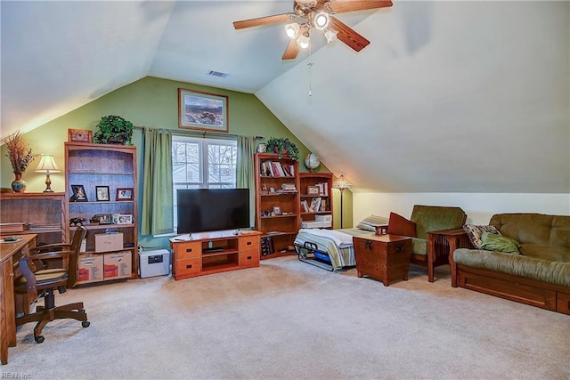 living area featuring carpet floors, ceiling fan, visible vents, and vaulted ceiling