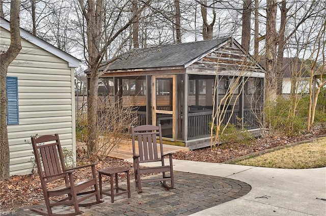 view of patio with an outbuilding