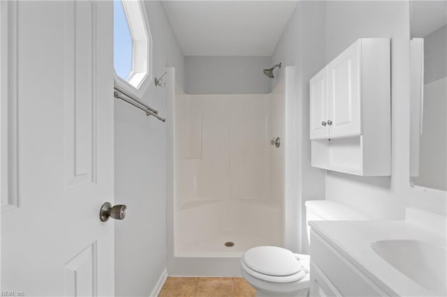 full bath featuring a shower, vanity, toilet, and tile patterned floors