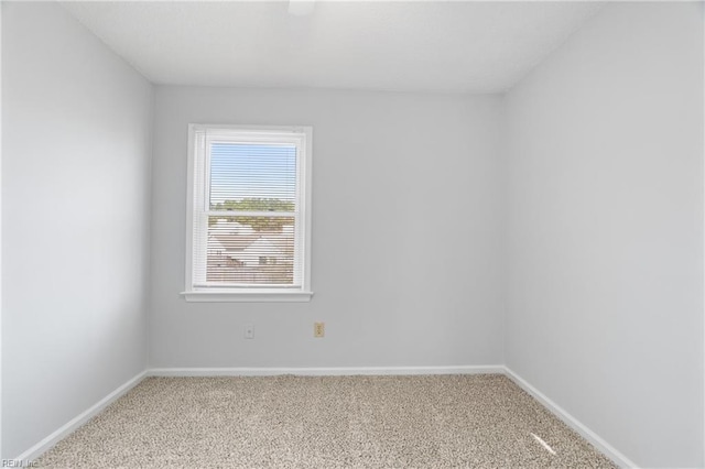 empty room with carpet floors and baseboards