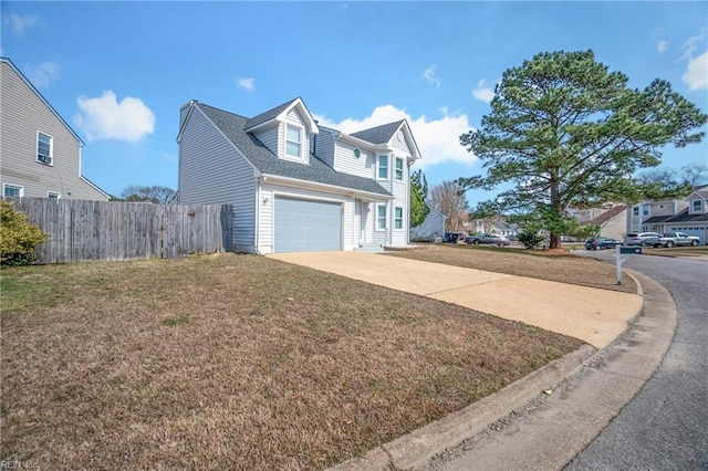 view of home's exterior featuring a garage, fence, driveway, a yard, and roof with shingles