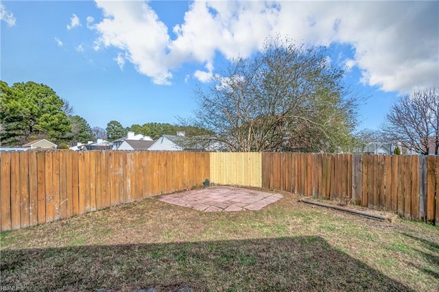 view of yard with a fenced backyard and a patio