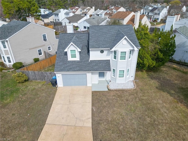 birds eye view of property with a residential view