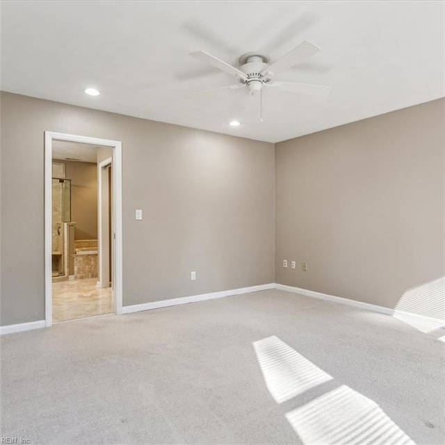 spare room featuring recessed lighting, baseboards, a ceiling fan, and light colored carpet