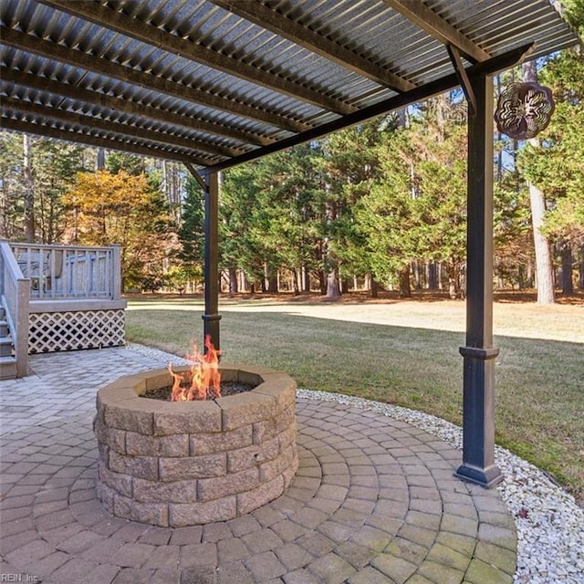 view of patio with an outdoor fire pit and a pergola