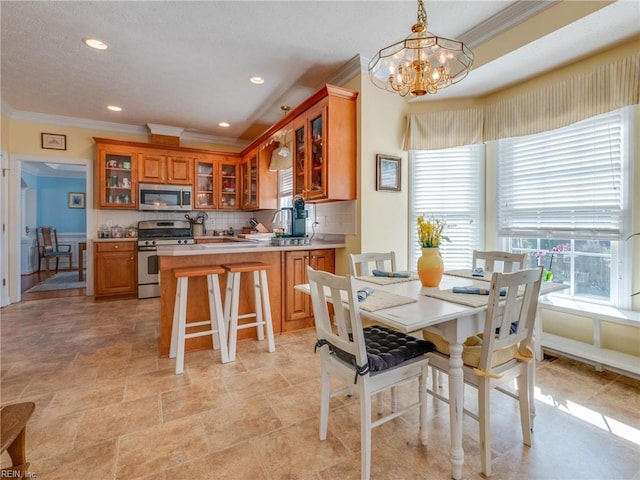 dining room with ornamental molding, recessed lighting, and a chandelier