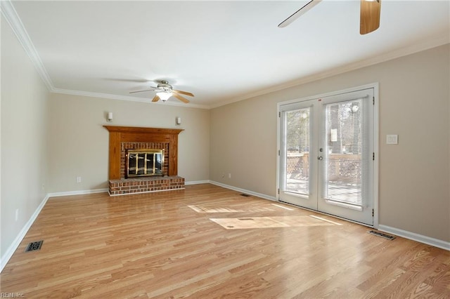 unfurnished living room with visible vents, ornamental molding, light wood-style flooring, and a ceiling fan