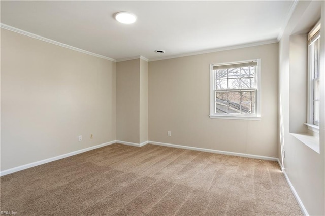 empty room with carpet, visible vents, ornamental molding, and baseboards