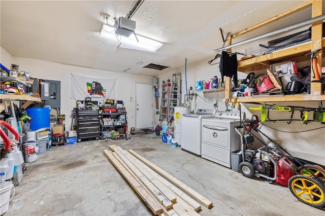 garage with a workshop area, washing machine and dryer, electric panel, and a garage door opener