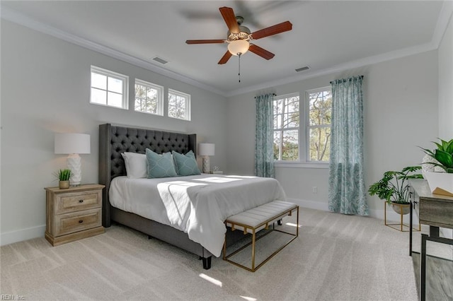 bedroom with ornamental molding, light colored carpet, and visible vents