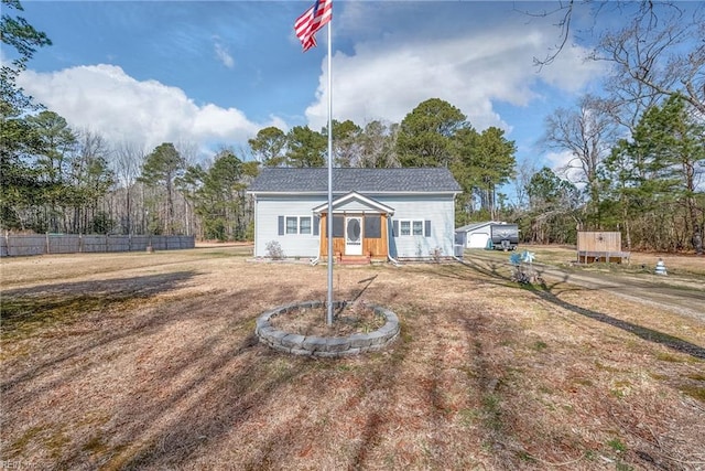 view of front of property featuring fence