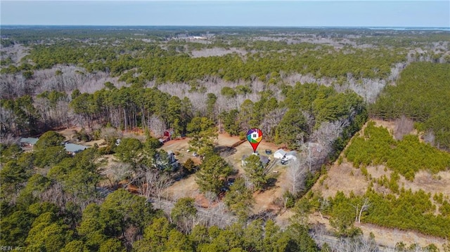 birds eye view of property with a forest view