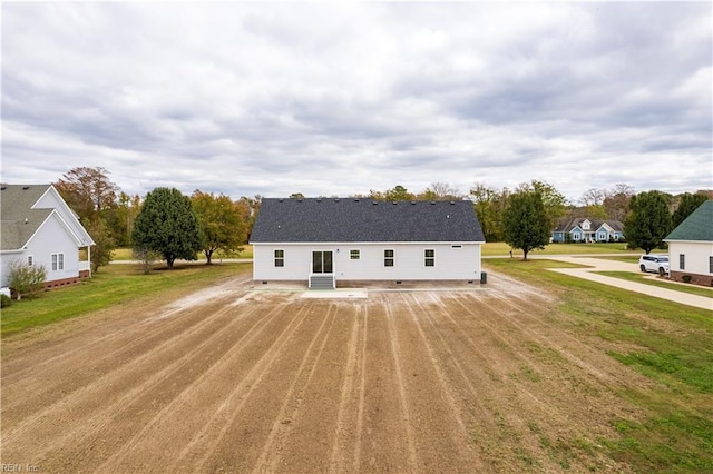 view of front of home with crawl space and a front yard