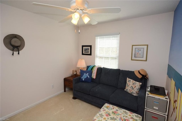 living room with ceiling fan, carpet floors, and baseboards