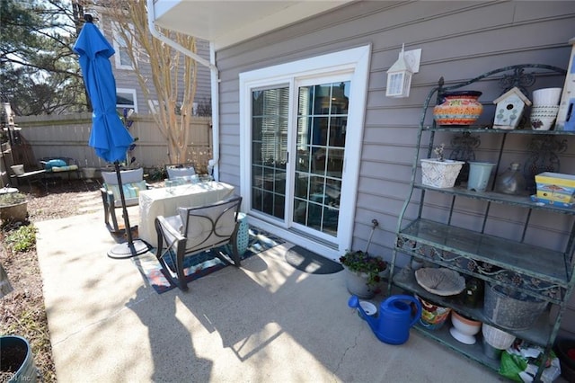 view of patio / terrace featuring fence