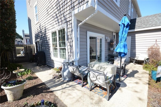 view of patio featuring fence