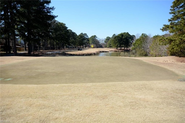 surrounding community featuring a water view