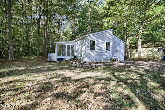 view of front of property featuring a sunroom